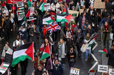 Demonstrators march as they protest in solidarity with Palestinians in Gaza, amid the ongoing conflict between Israel and Hamas, in London on Dec. 9. Huge demonstrations against the Israeli military’s attacks on Gaza have been taking place in the U.K. and elsewhere.
