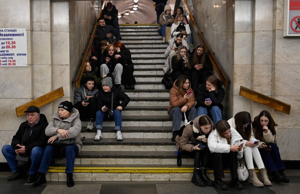 People take shelter in a subway station in Kyiv amid a Russian missile attack on Friday. 