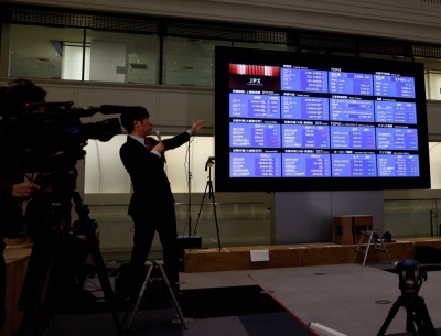 A Nikkei stock board after a ceremony marking the end of trading in 2023, in Tokyo on Friday. 