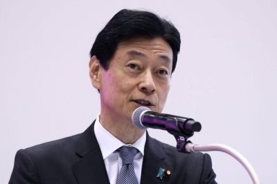 Then-industry minister Yasutoshi Nishimura speaks at an exhibition in Tokyo on Dec. 13. 