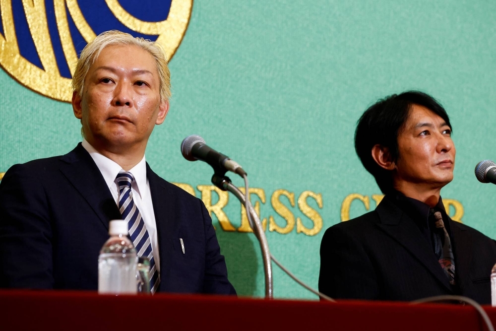 Junya Hiramoto and Shimon Ishimaru, members of Johnny's Sexual Assault Victims Association who claim to have been sexually abused by the late founder of Johnny & Associates, hold a news conference at the Japan National Press Club in Tokyo in September