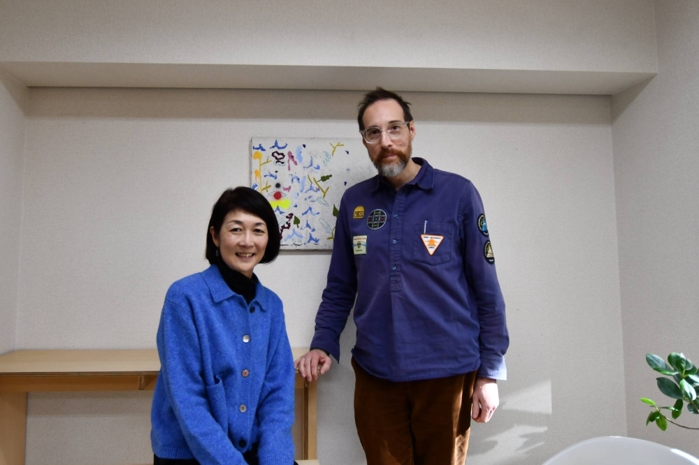 Yuko Shiomi and Roger McDonald, director and deputy director of Arts Initiative Tokyo, at the nonprofit's office in the capital's Shibuya Ward on Dec. 7