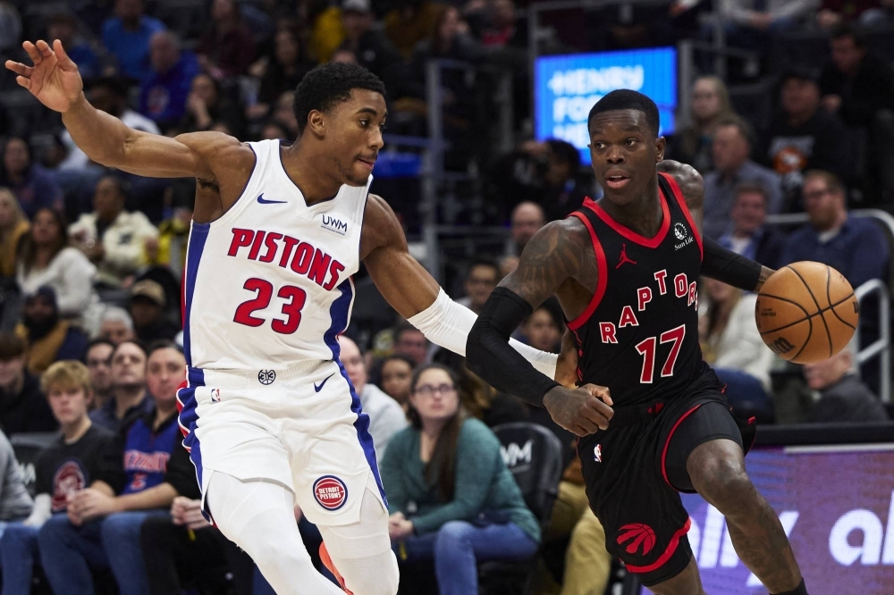 Raptors guard Dennis Schroder is defended by Pistons guard Jaden Ivey during the second half in Detroit on Saturday as the Pistons snapped their 28-game losing streak. 