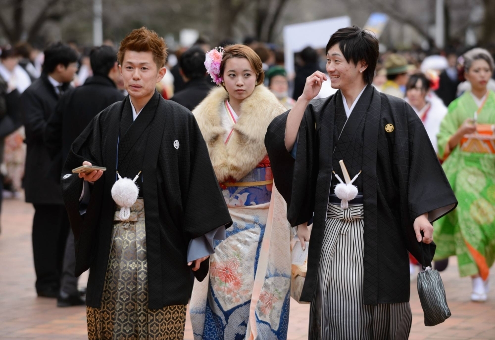 Young men and women celebrate Coming of Age Day in Kawasaki, Kanagawa Prefecture, on Jan. 11, 2016. 