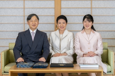 Emperor Naruhito, Empress Masako and Princess Aiko pose for a photo at the Imperial Palace in Tokyo on Dec. 1. 