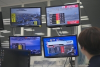 A man watches TV screens in Osaka showing news of a powerful earthquake that hit the Noto Peninsula area in Ishikawa Prefecture on Monday. | KYODO