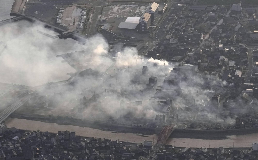 Smoke rises from the site of a fire in the city of Wajima, Ishikawa Prefecture, on Tuesday.