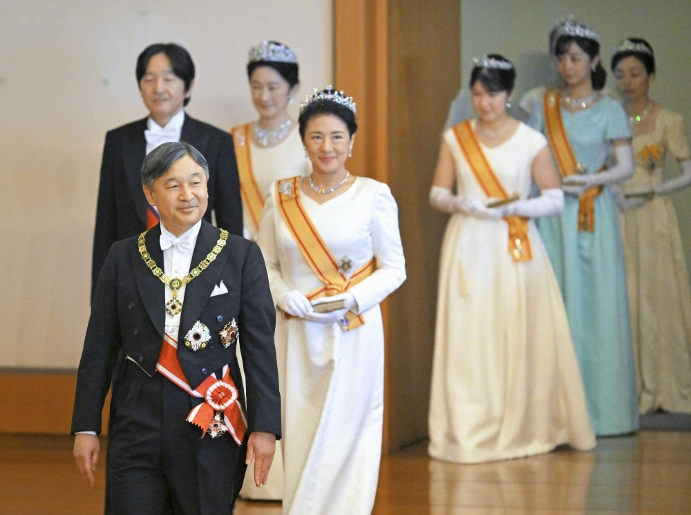 Emperor Naruhito and his family members attend a New Year's ceremony at the Imperial Palace in Tokyo on Monday.