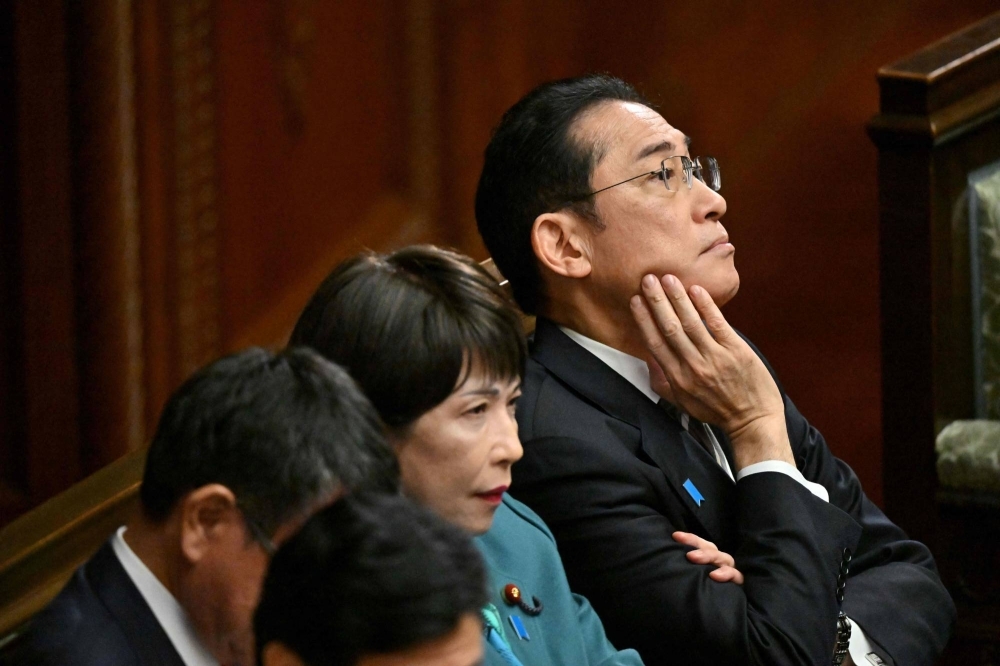 Prime Minister Fumio Kishida awaits the results of a no-confidence vote against his Cabinet in the country's parliament on Dec. 13.