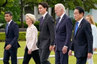 From left: British Prime Minister Rishi Sunak, European Commission President Ursula von der Leyen, Canadian Prime Minister Justin Trudeau, U.S. President Joe Biden and Japan's Prime Minister Fumio Kishida walk to a flower wreath laying ceremony at the Peace Memorial Park in Hiroshima in May during the G7 Summit. | Pool / via REUTERS