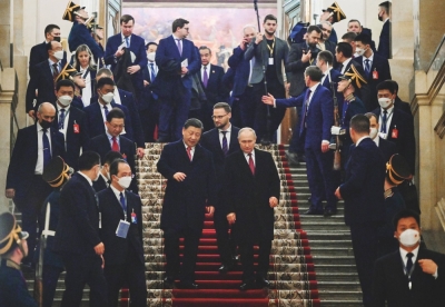 Russian President Vladimir Putin and China's President Xi Jinping after a reception following their talks at the Kremlin in Moscow on March 21. China has refused to push back against the Kremlin's invasion of Ukraine, in the hopes that the war would weaken the United States and NATO. 