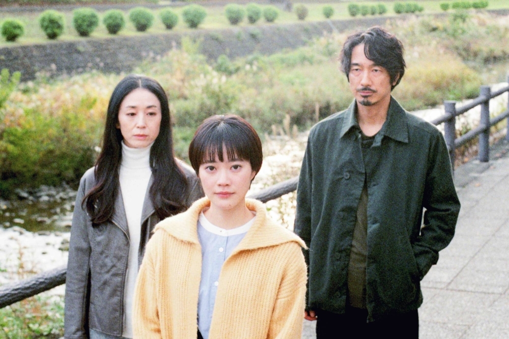 Haru (An Ogawa, center) searches for the origin of a recording left by her late mother, while keeping a watchful eye over two older acquaintances, in “Following the Sound.”