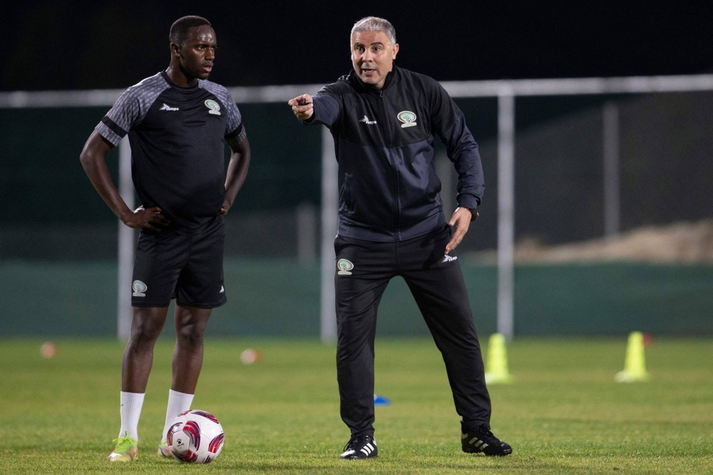 Palestine's coach Makram Daboub speaks to his players during a training camp in Abha on Dec. 29. 