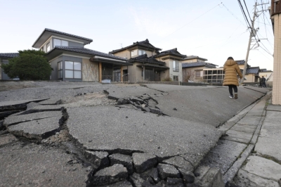 A road in the town of Uchinada, north of Kanazawa, Ishikawa Prefecture, is seen liquefied and uplifted by Monday's earthquake.