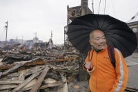 A man near burned-down remains in Wajima said he did not know of fires following a major quake hitting the area two days before because he lost power and couldn't watch the news on TV. | KYODO