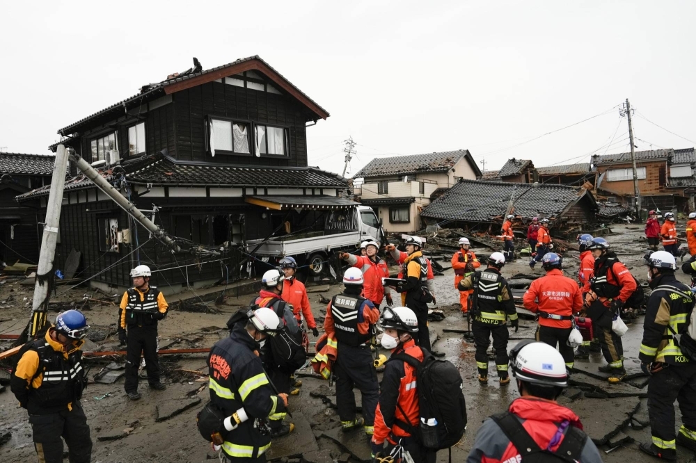 Rescue workers conduct a search operation in Suzu, Ishikawa Prefecture.