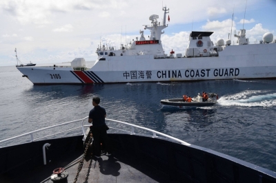 A Chinese coast guard ship blocks a Philippine Bureau of Fisheries and Aquatic Resources' vessel near the Chinese-controlled Scarborough Shoal in the disputed South China Sea on Sept. 22.
