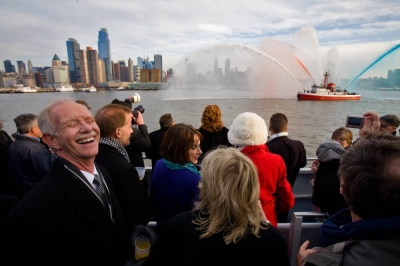 Capt. Chesley B. "Sully" Sullenberger III, left, the pilot responsible for miraculously soft landing in New York's Hudson River in 2009, celebrates on a ferry in Manhattan on Jan. 15, 2010. 