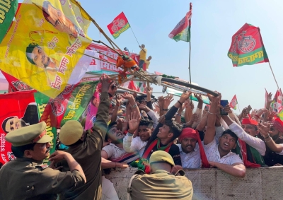 Supporters of India's regional Samajwadi Party take part in a campaign rally in Varanasi, India, in March 2022.