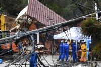Rescuers search for missing victims at a landslide site in the Kawashima district in the city of Anamizu, Ishikawa Prefecture, on Saturday after a major earthquake struck the Noto region on New Year's Day. | AFP-JIJI