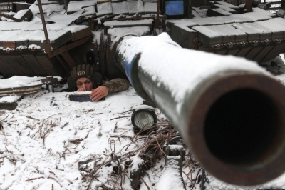 A Ukrainian tank crew member looks out from a tank as he holds his position near the town of Bakhmut, in the country's Donetsk region, on Dec. 13.