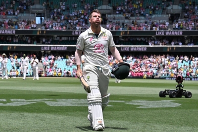 David Warner walks off the pitch in his final test cricket match on Saturday in Sydney. 