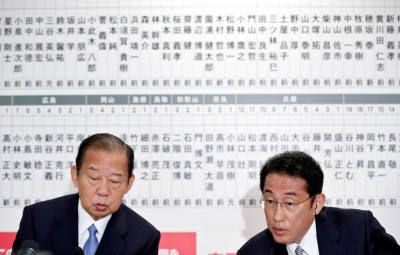 Then-LDP Secretary-General Toshihiro Nikai and then-LDP policy chief Fumio Kishida at the party's headquarters in Tokyo in October 2017. 