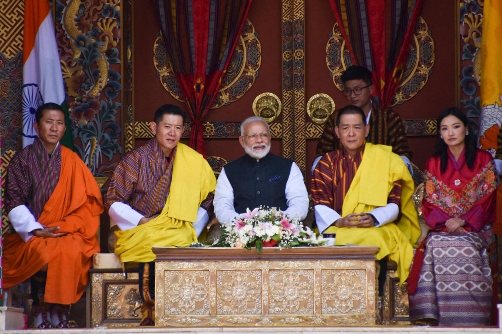 Indian Prime Minister Narendra Modi (center) sits next to Bhutan's King Jigme Khesar Namgyel Wangchuck (second from left) and others, while watching a cultural performance at the Tashichhodzong monastery in Thimpu, Bhutan, in August 2019.