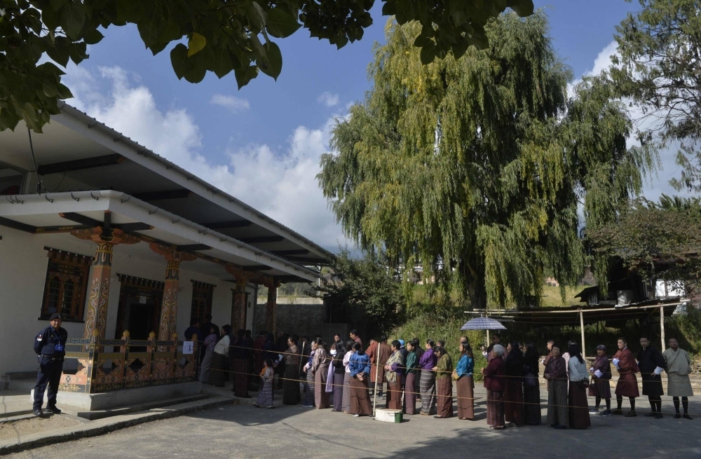 People line up to vote at a polling station in Thimpu in October 2018. People line up to vote at a polling station in Thimpu in October 2018.
