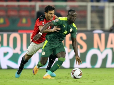 Egypt's Hamdi Fathi chases after Senegal's Sadio Mane during the Africa Cup of Nations final in Cameroon in February 2022. 