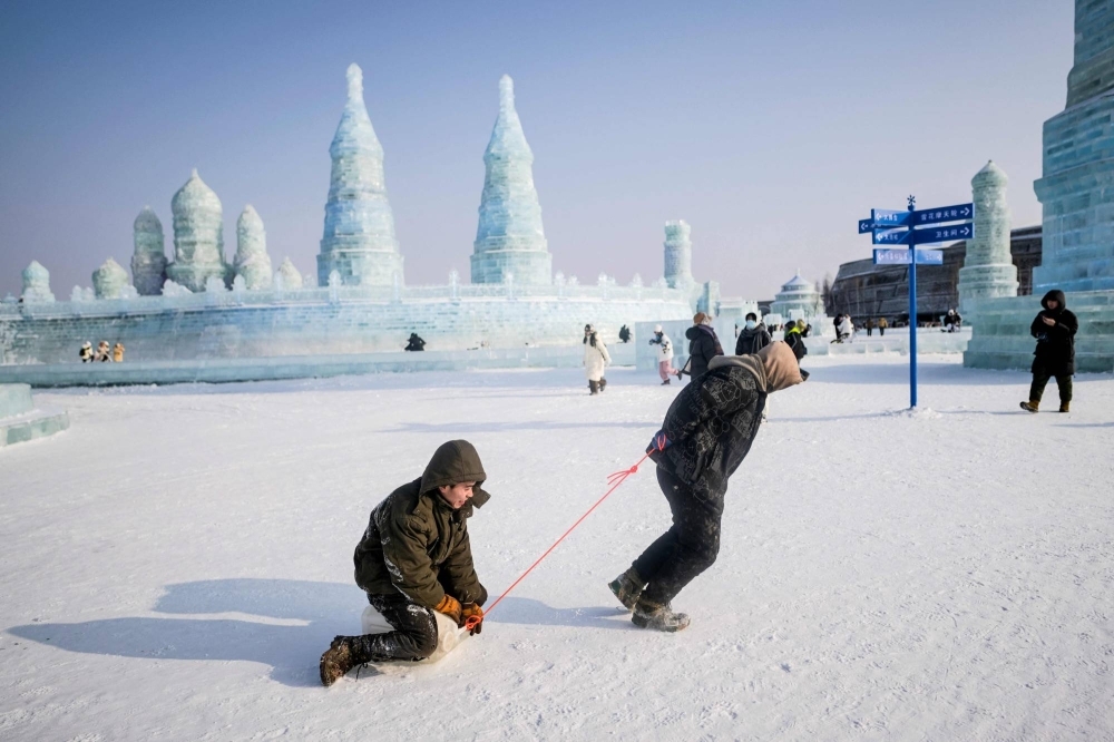 People visit the Ice and Snow Festival in Harbin, China, on Friday.