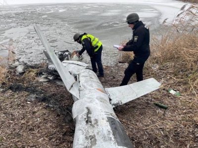 Ukrainian officials inspect a Russian cruise missile shot down near Kyiv in January 2023.