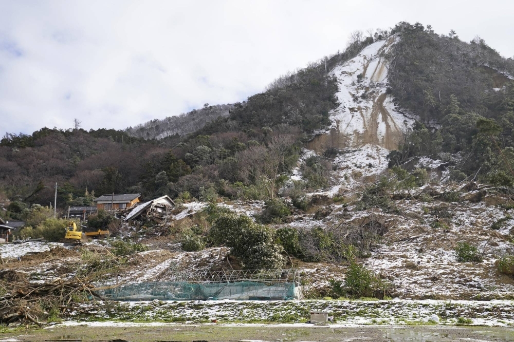 Rescuers continued to search for people on Monday after a landslide hit the town of Nie in Suzu.