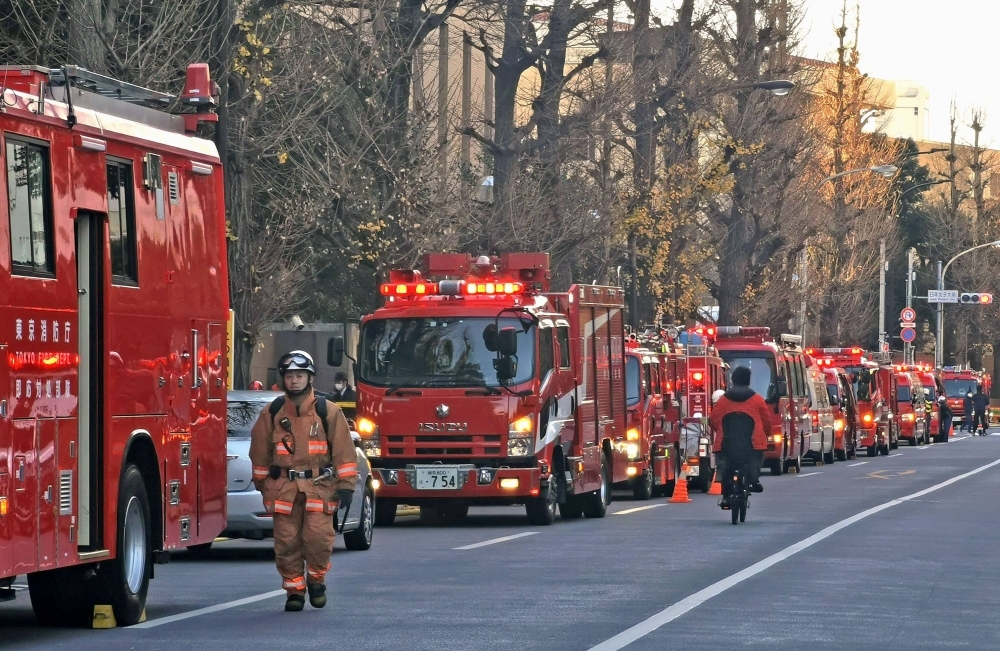 Fire engines gather Monday near a residence in Tokyo's Bunkyo Ward where late Prime Minister Kakuei Tanaka used to live.