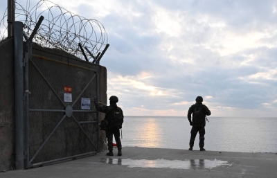 South Korean marines patrol the entrance to a beach on Yeonpyeong Island, near the Northern Limit Line sea boundary with North Korea, on Monday.