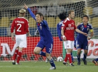 Japan's Yasuhito Endo celebrates after scoring a goal from a free kick during a 2010 World Cup Group E soccer match against Denmark in Rustenburg, South Africa, in June 2010. | Reuters