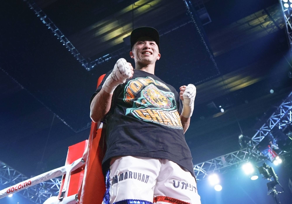 Japan's Naoya Inoue celebrates after defeating Marlon Tapales of the Philippines in their four-belt world super bantamweight title unification match at Ariake Arena in Tokyo on Dec. 26.