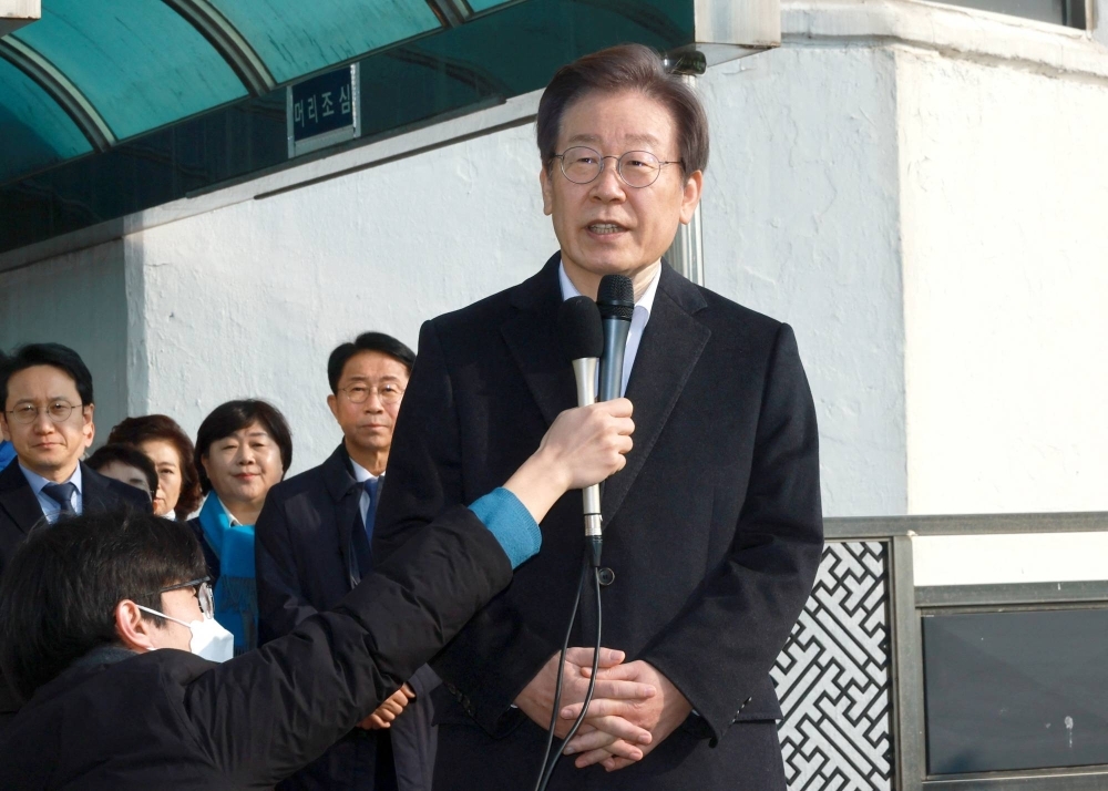 South Korea's opposition Democratic Party leader, Lee Jae-myung, speaks after being discharged at Seoul National University Hospital in Seoul on Wednesday.