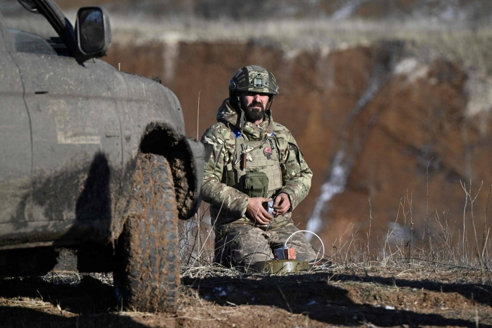 A Ukrainian sapper from the 22nd Separate Mechanized Brigade prepares an anti-tank mine during a military training exercise in Ukraine's Donetsk region on Nov. 28, amid the Russian invasion of Ukraine. Sappers are often the first to get to the front line, clearing territory before assault troops, but work also to allow civilians to return to their homes.
