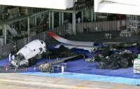 Wreckage from a Japan Airlines jetliner that collided with a Japan Coast Guard aircraft at Tokyo's Haneda Airport in a hangar on Jan. 7 | Kyodo