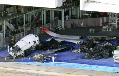 Wreckage from a Japan Airlines jetliner that collided with a Japan Coast Guard aircraft at Tokyo's Haneda Airport in a hangar on Jan. 7