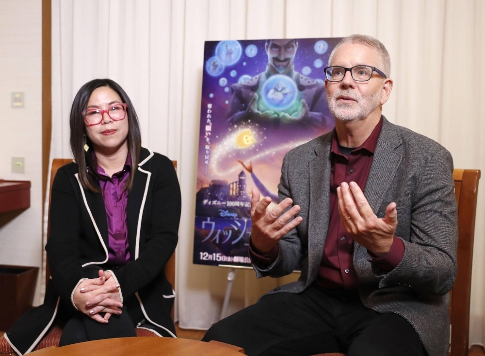 Chris Buck (right) and Fawn Veerasunthorn, directors of the Disney film “Wish,” discuss their new movie in Tokyo.