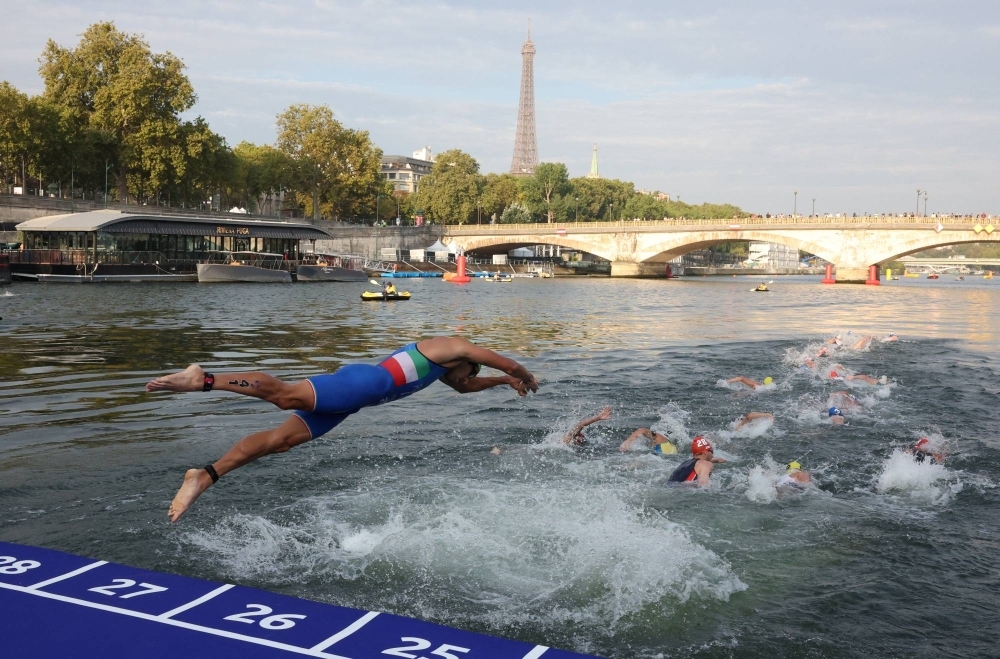 A triathlon Olympic test event in the River Seine in August of last year. Local authorities still have thousands of new sewer connections and key storm-water infrastructure to finish in the next few months ahead of the Games. 