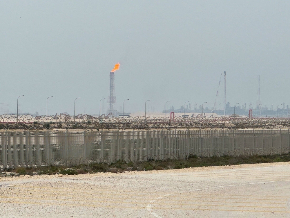 QatarEnergy’s LNG site is ringed by barbed-wire-topped chain link fences. 