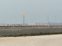 QatarEnergy’s LNG site is ringed by barbed-wire-topped chain link fences.  | Bloomberg
