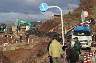 Construction work is carried out Thursday to restore roads severely damaged by a major quake in Wajima, Ishikawa Prefecture.