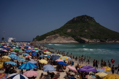 People cool off on a beach in Rio de Janeiro in November amid a heat wave.
