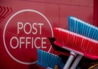 A Post Office sign at a branch in a local convenience store near Ascot, England, on Friday. The Post Office scandal, where some 980 U.K. Post Office workers were wrongfully convicted of theft and false accounting, was triggered by faults in a Fujitsu computer system called Horizon that was used by U.K. Post Offices and inaccurately reported shortfalls in their accounts, resulting in private prosecutions of innocent branch managers for theft. 