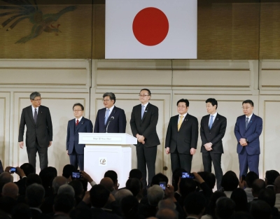 Key members of the largest faction of the ruling Liberal Democratic Party, formerly headed by late former Prime Minister Shinzo Abe, stand on a stage during the faction's fundraising party held at a Tokyo hotel in May.