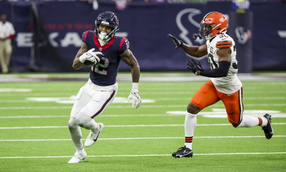Texans wide receiver Nico Collins races past a defender during the second quarter of Houston's win over Cleveland on Saturday in Houston. 